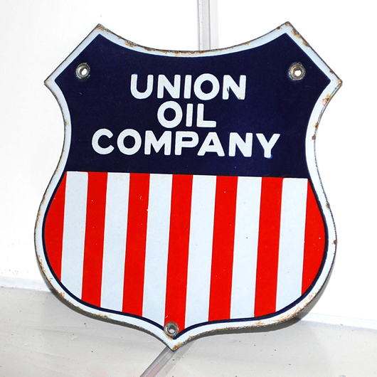 Union Oil Company single-sided porcelain die-cut sign with tri-color logo, rated 9+, $2,300. Matthews Auctions image.